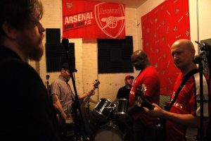 Punk-rock band, Guns Don’t Run, practice in Brooklyn on Nov.29, 2015. From left to right - Austin WIlliams (Insurance), Justin Miran (Finance), Daniel Jaryniewichor (Food Industry), Ron Treasure (Insurance), Henry (Jamie) Behar (Gynaecology). “We’re friends. This is our hobby, our card game. We do everything we love, drinking and watching football (soccer),” Mirans says about Guns Don’t Run.