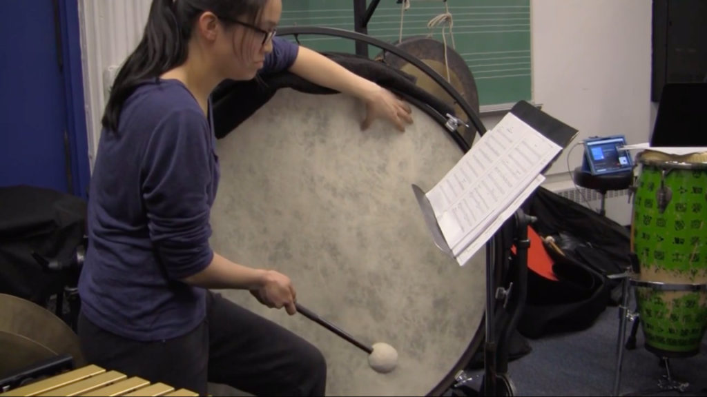 NYU percussion major plays the base drum during the master class in which percussion students prepared for the concert.