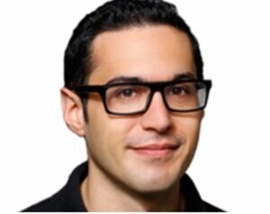 Picture of Eric Kohn -- a white man with rectangular-framed glasses -- above IndieWire's logo