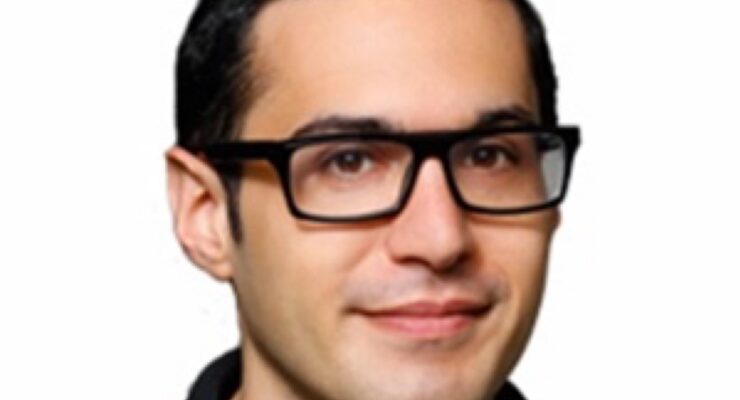 Picture of Eric Kohn -- a white man with rectangular-framed glasses -- above IndieWire's logo