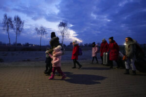 Refugees fleeing conflict in neighboring Ukraine arrive to in Przemysl, Poland, on Feb. 27, 2022. The U.N. refugee agency says more than 4 million refugees have now fled Ukraine following Russia’s invasion, a new milestone in the largest refugee crisis in Europe since World War II. (AP Photo/Petr David Josek)