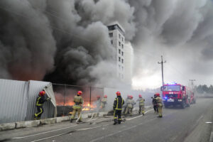 Firefighters work to extinguish a fire at a damaged logistic center after shelling in Kyiv, Ukraine, March 3, 2022. Kyiv was a Russian defeat for the ages. It started poorly for the invaders and went downhill from there. (AP Photo/Efrem Lukatsky, File)