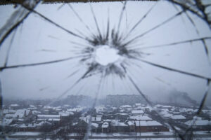 A hospital window is cracked from shelling in Mariupol, Ukraine, Thursday, March 3, 2022. Russia began evacuating its embassy in Kyiv, and Ukraine urged its citizens to leave Russia. Unbroken by a Russian blockade and relentless bombardment, the key port of Mariupol is still holding out, a symbol of staunch Ukrainian resistance that has thwarted the Kremlin's invasion plans. (AP Photo/Evgeniy Maloletka)