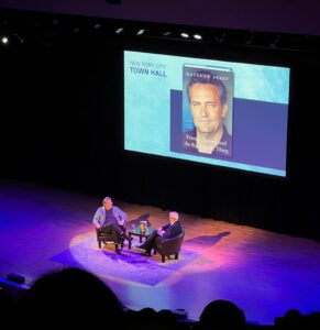 Matthew Perry and Sirius XM radio host Jess Cagle on stage at New York City Town Hall.