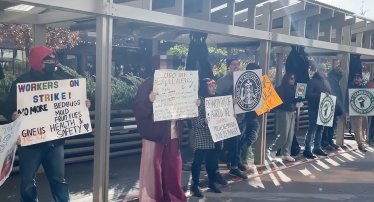 Union workers protest outside the NYC Starbucks Reserve Roastery.