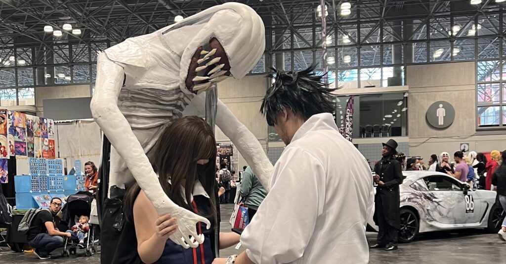 A picture of two people dressed in anime costumes