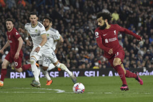 Liverpool's Mohamed Salah, right, scores his side's second goal during the English Premier League soccer match between Leeds United and Liverpool at Elland Road in Leeds, England, Monday, April 17, 2023