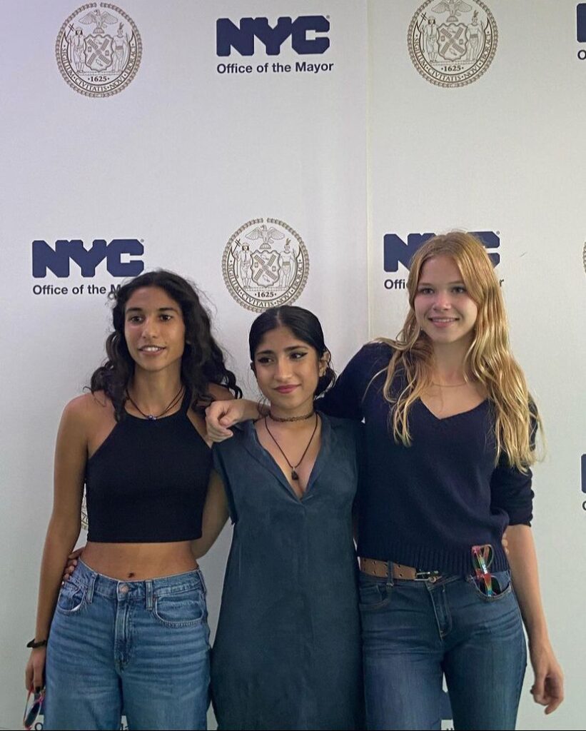 Heeta Thakkar and her team posing for photos at the NYC Office of the Mayor