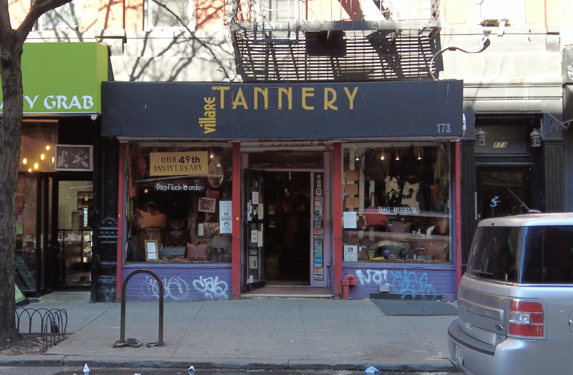 The storefront of Village Tannery on the corner of Bleecker Street and Sullivan Street in Manhattan, New York.