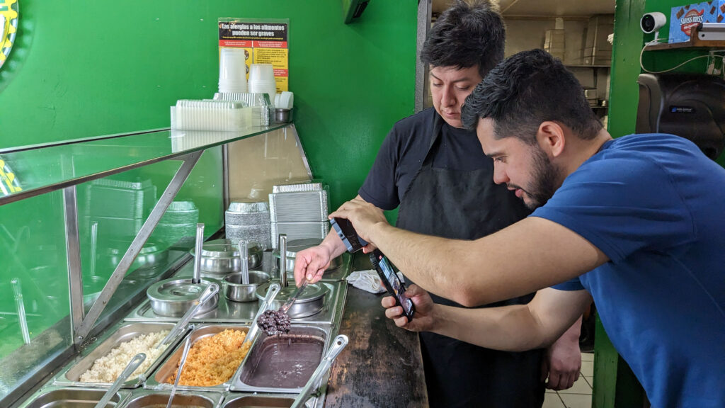 TikToker Luis Flores films Mexican food at a Bronx eatery.