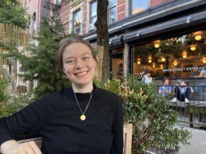 Photo of Emi Nietfeld Outside of Elsewhere Espresso, New York City