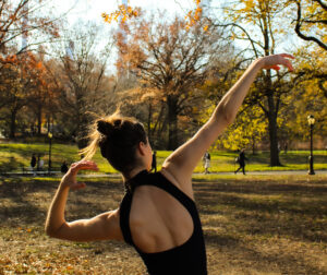 Dancer dancing in Central Park during the fall season.